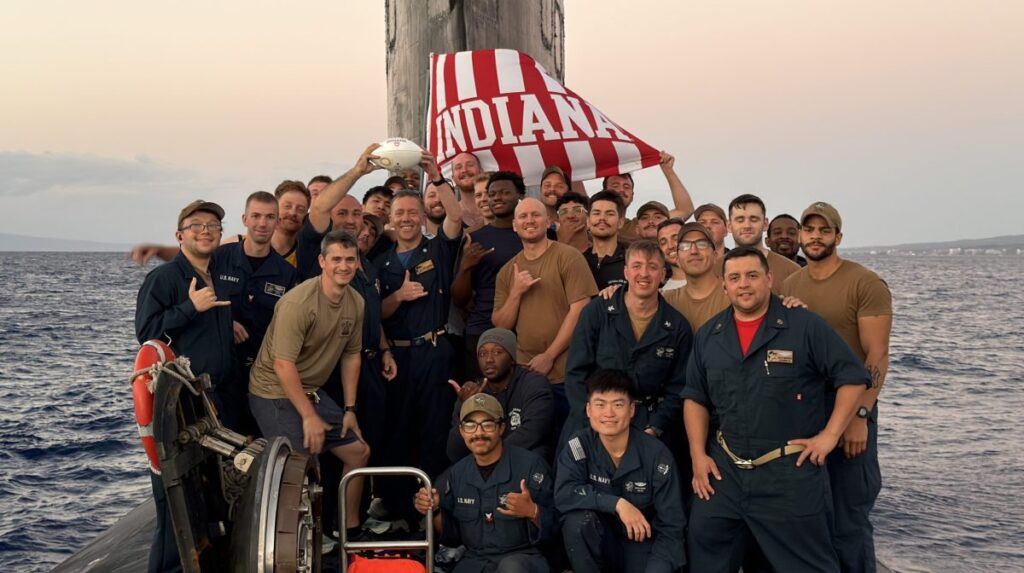 Crew of USS Indiana submarine snaps football celebration photo