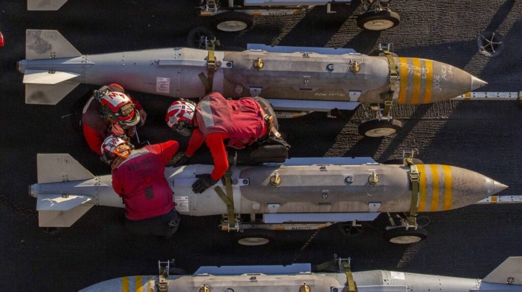 Sailors on US carrier write their names on bombs headed to Iran