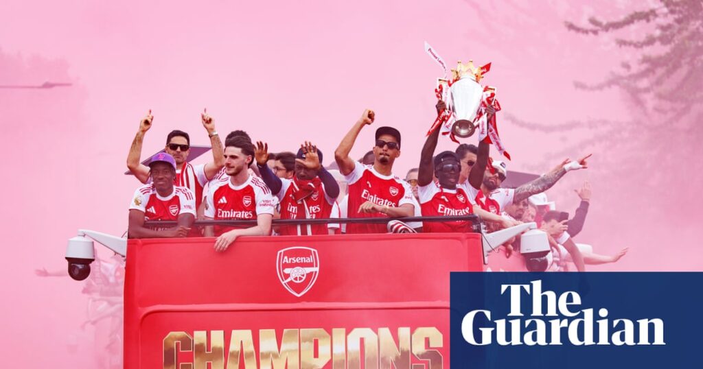 Red alert: huge crowd watches Arsenal trophy parade in north London – in pictures