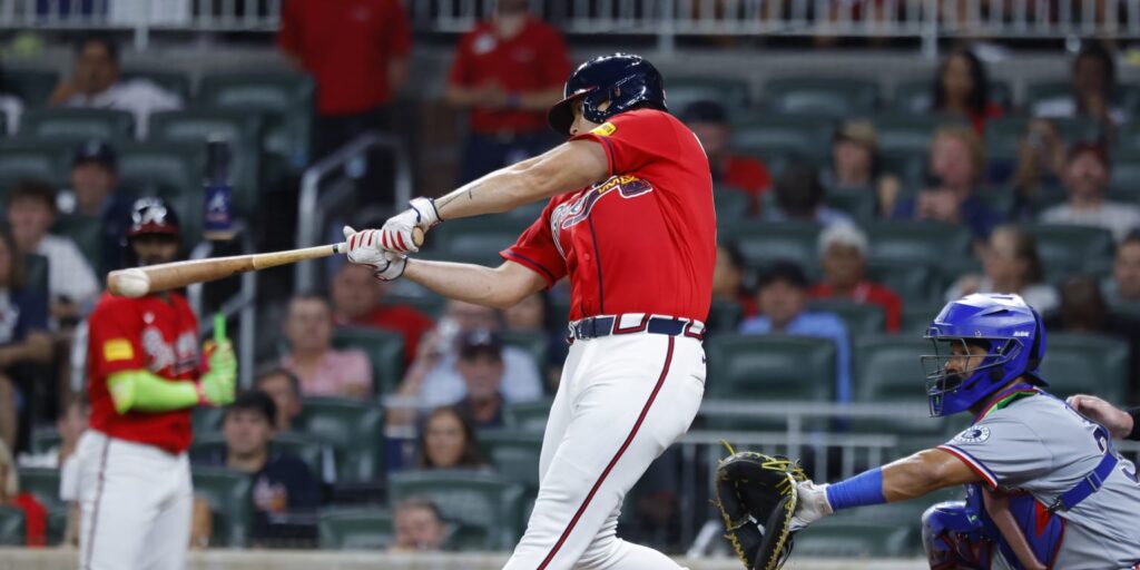 Braves pitcher Victor Mederos gets hit off Rangers catcher Kyle Higashioka