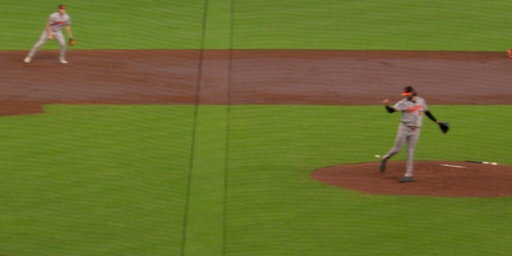 Orioles pitcher Brandon Young kicks ball for out Orioles pitcher Brandon Young kicks ball for out