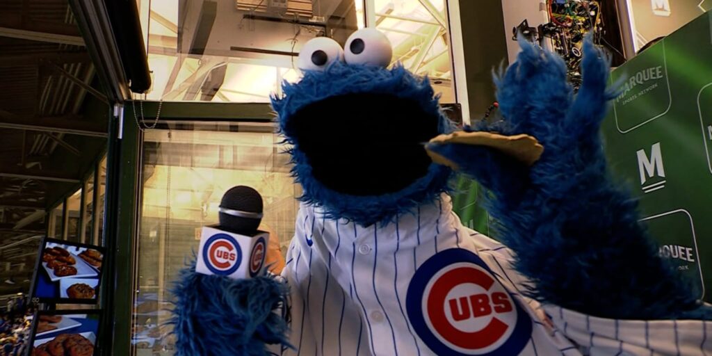 Cookie Monster celebrates National Chocolate Chip Cookie Day at Wrigley Field